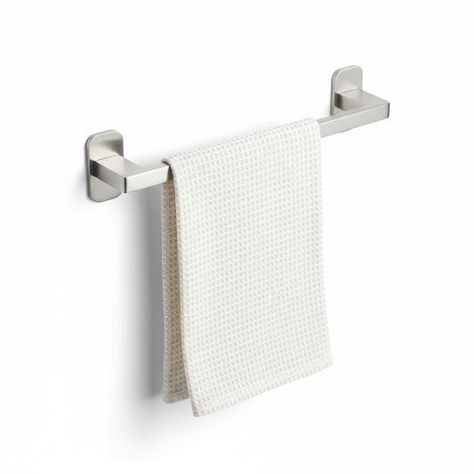 Brushed stainless steel kitchen towel holder bar with folded dish towel on pure white background