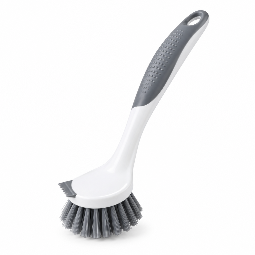 Dish scrub brush with ergonomic handle, compact round scrubbing head, and scraper edge on white background