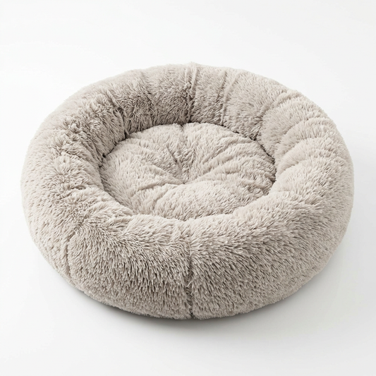 Round donut pet bed with raised circular bolster rim and fluffy shag plush fabric on pure white background