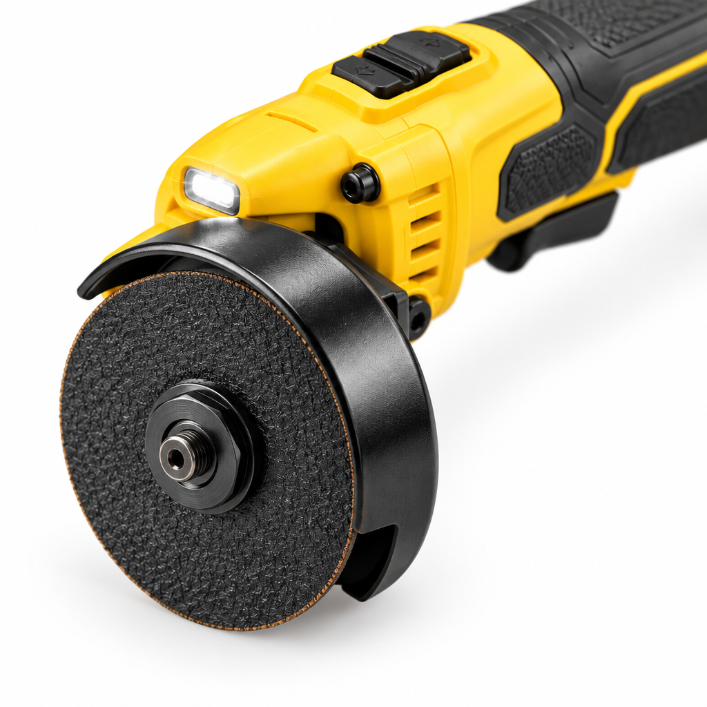 Close-up macro view of the compact cut-off tool 3-inch cutting wheel, steel spark guard, arbor flange bolt, and forward/reverse switch on a pure white background