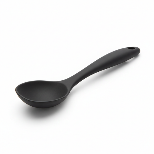 Matte black one-piece silicone cooking spoon with hanging hole on pure white background