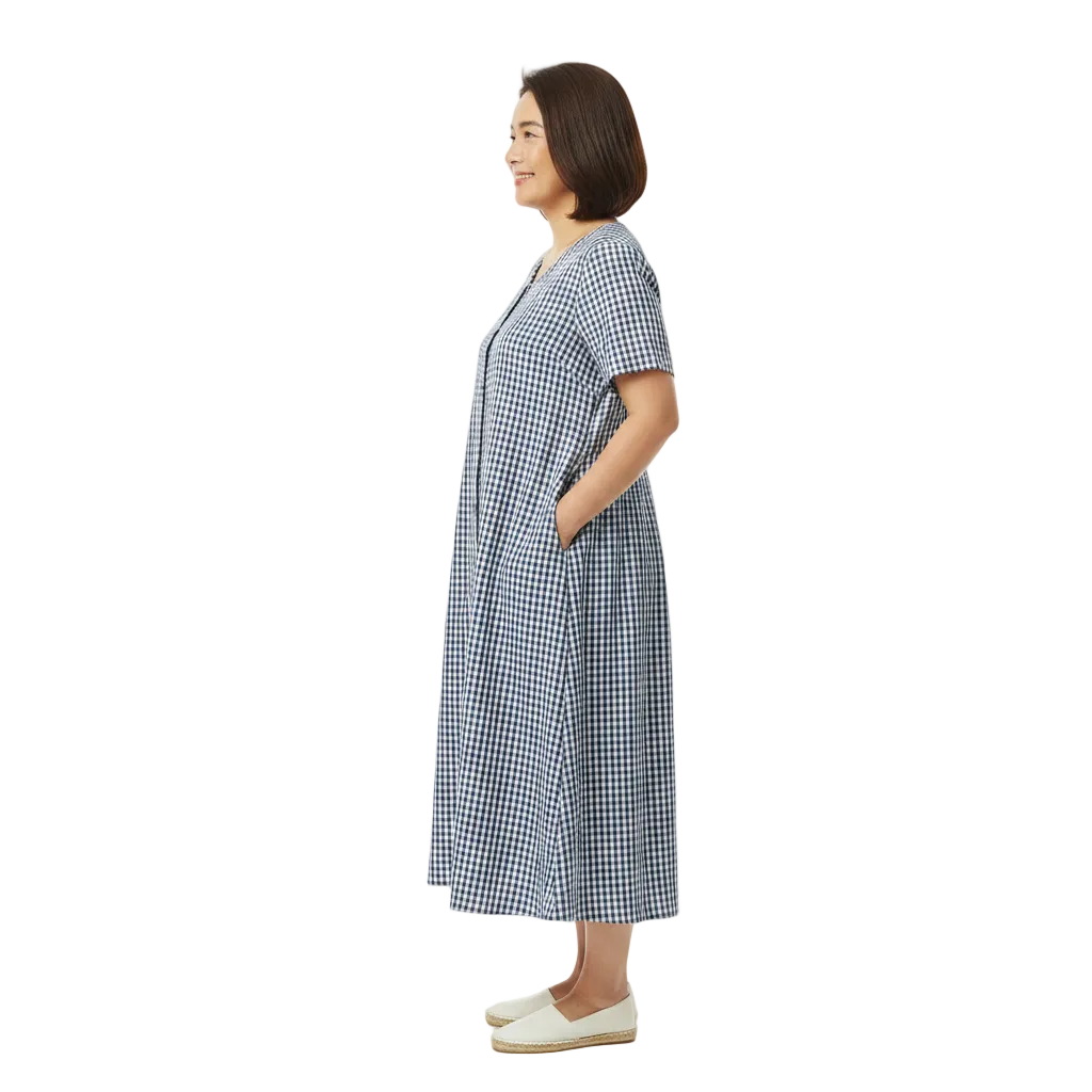 Side profile view of short sleeve button front midi dress with pockets on white background