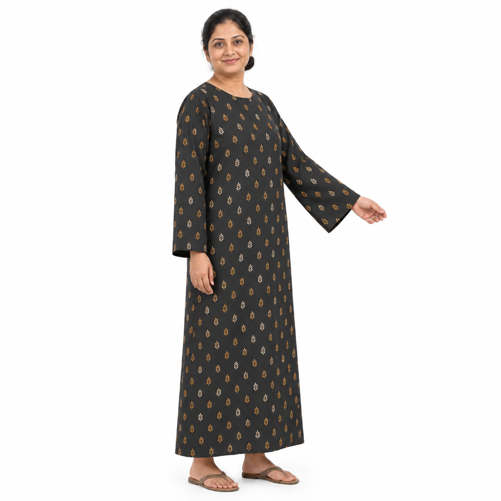 Angled full-length view of charcoal leaf-print kaftan abaya showing its loose silhouette and long wide sleeve on white