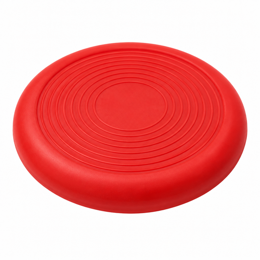 Flexible natural rubber dog flying disc with aerodynamic raised rim and concentric grip ridges on pure white background