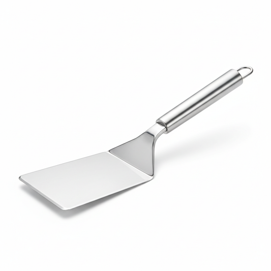 Wide blade stainless steel kitchen turner with beveled front edge on pure white background