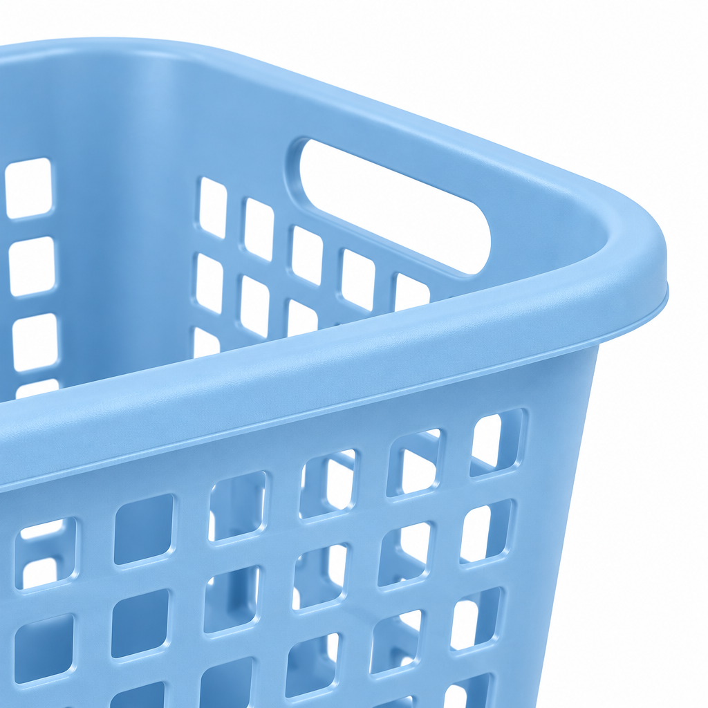 Macro close-up of plastic laundry basket ergonomic cutout handle, rolled upper rim, and ventilated lattice grid