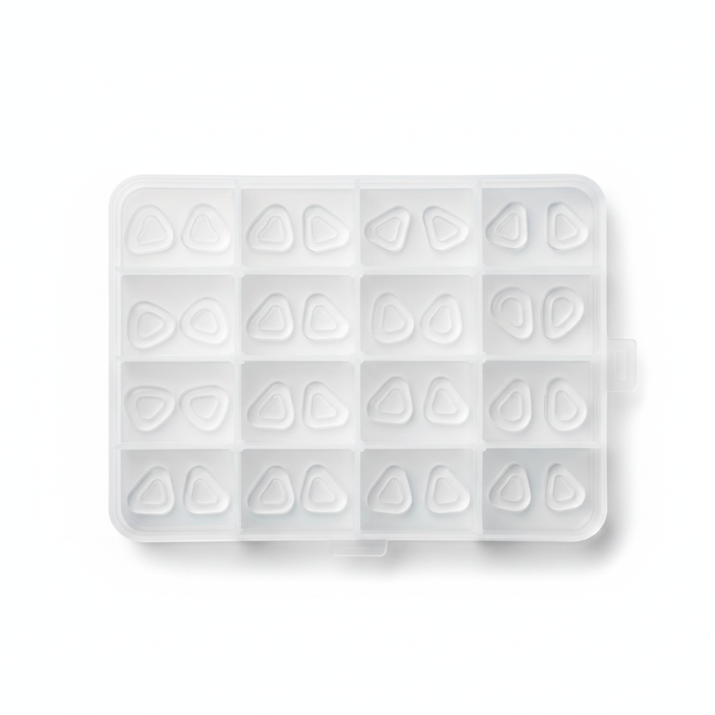 Multi-compartment plastic organizer box with sorted silicone nose pads flat lay