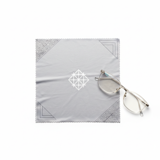 Eyeglass lens cleaning cloth with custom printed logo and laser cut edge on white background