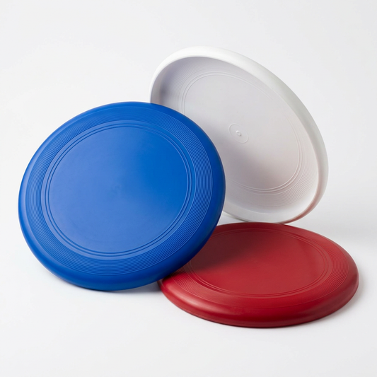 Outdoor flying discs displayed in different colors for recreational throwing games.