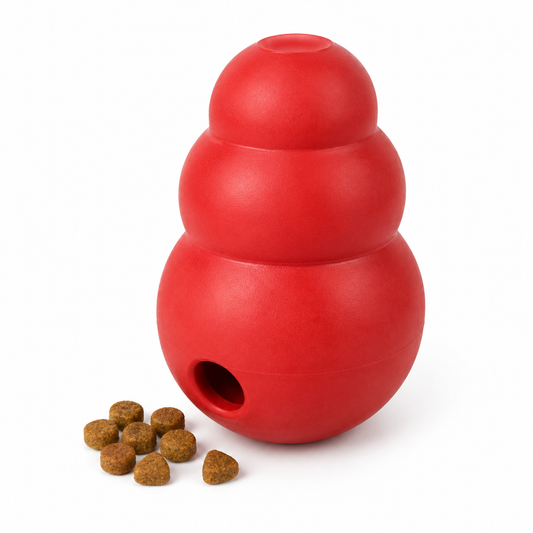 Vibrant red 3-tiered rubber treat-dispensing dog toy with dry kibble on pure white background