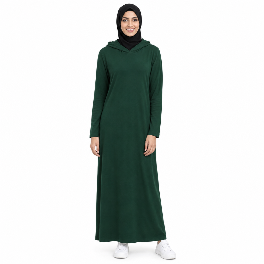 Model in a black hijab wearing a dark green lightweight full-length hooded modest dress with the hood resting down, on a white background