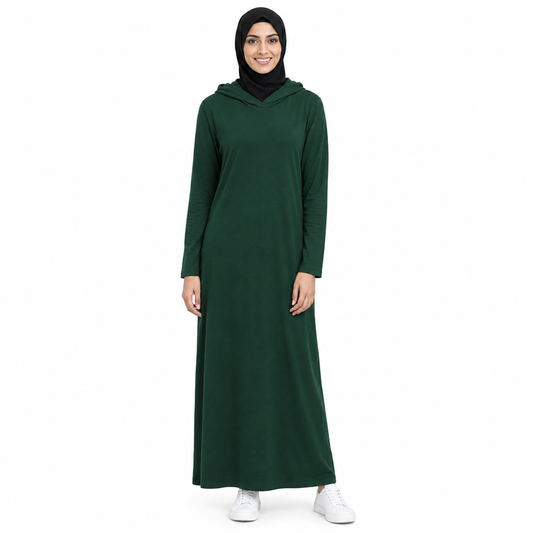 Model in a black hijab wearing a dark green lightweight full-length hooded modest dress with the hood resting down, on a white background