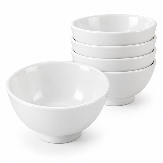 Empty round white glazed ceramic rice bowl showing glossy finish and footed base, alongside a stack of four nested bowls demonstrating compact stackable storage on a pure white background