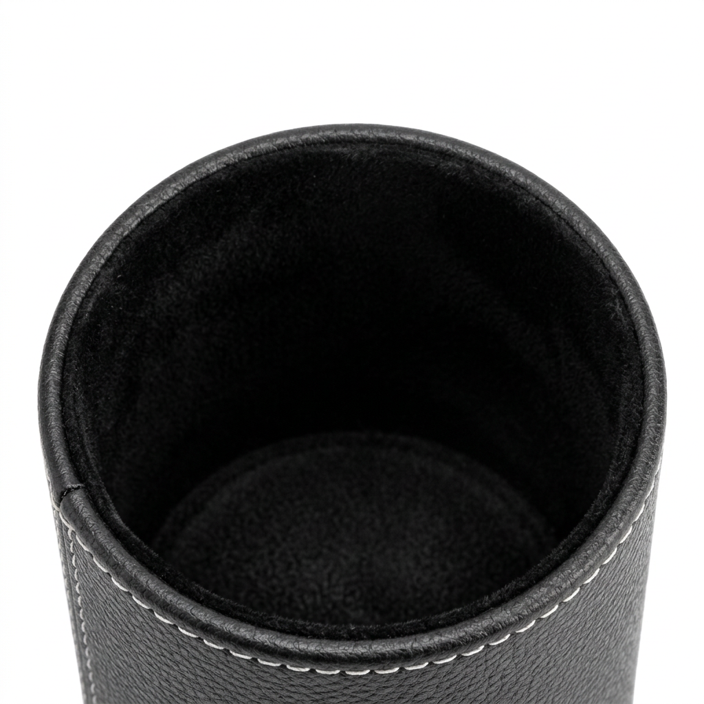 Detail close-up of pen holder showing top rim opening, white stitching, and velvet lining on white background