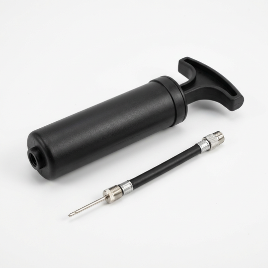 Portable manual sports ball pump with its actual hose and inflation needle configuration.
