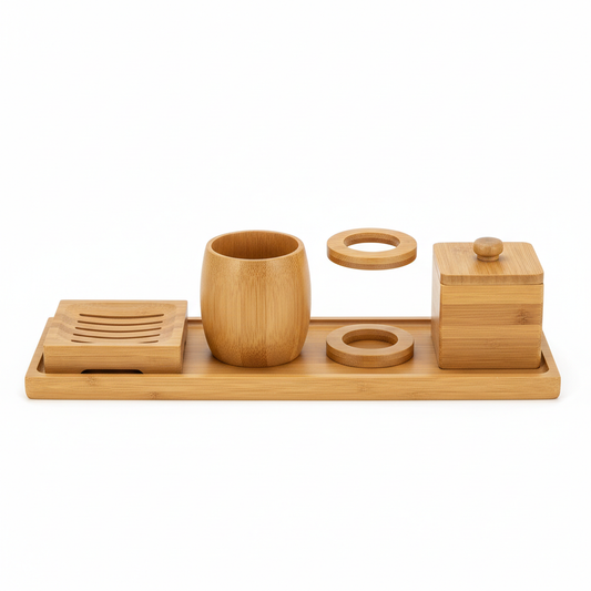 Five-piece coordinated natural bamboo hotel bathroom accessory set including soap dish, tumbler cup, toothbrush holder, cotton swab box and amenity tray on white background, eco-friendly guestroom bathroom set
