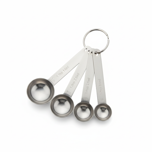 Stainless steel measuring spoon set fanned out with detachable ring on pure white background
