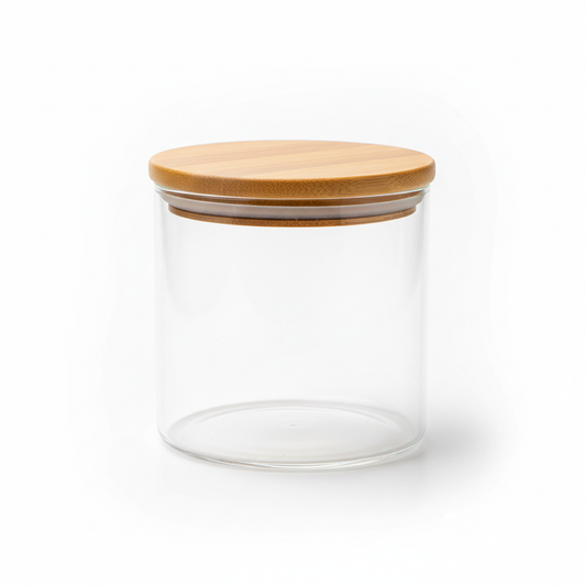 Cylindrical clear borosilicate glass food container with natural bamboo lid on pure white background