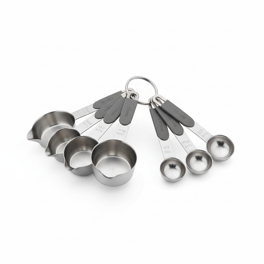 8-piece stainless steel measuring cup and spoon combo set fanned out on pure white background
