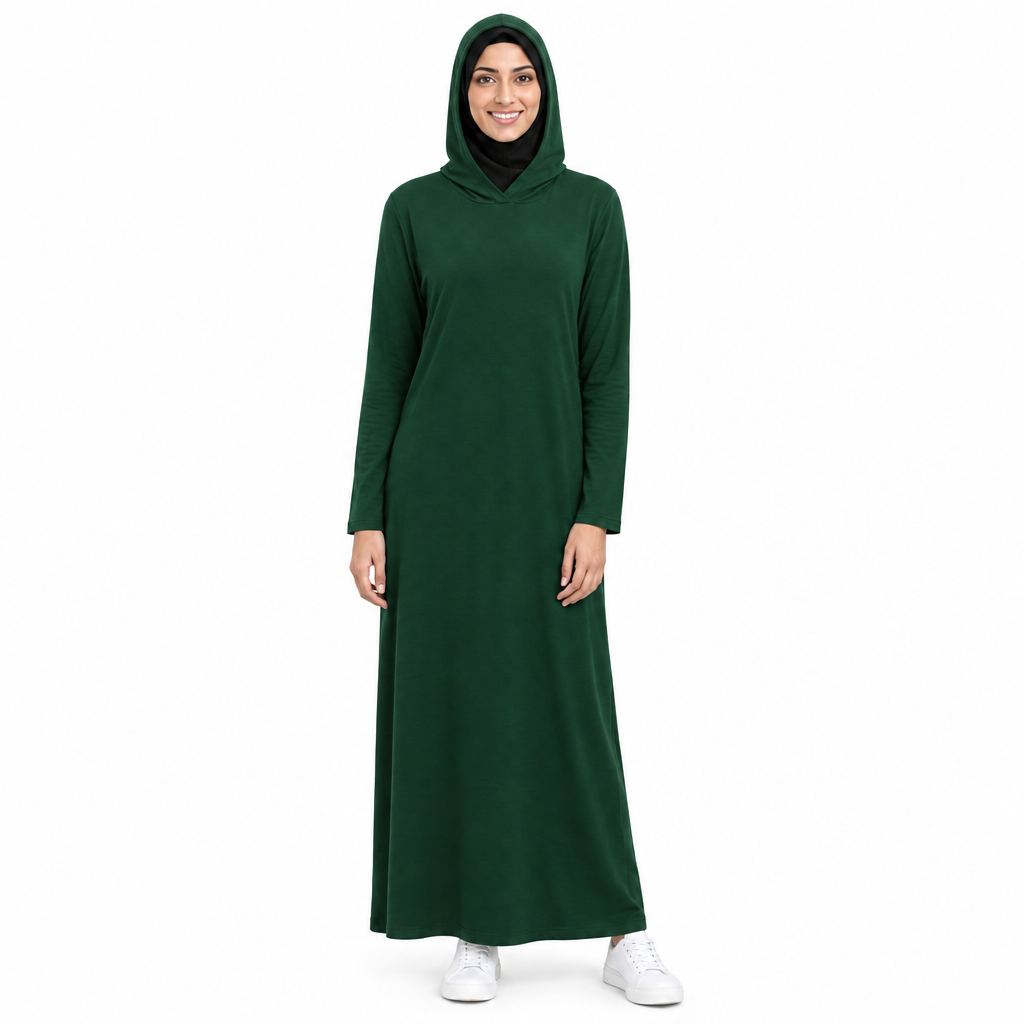 Same dark green hooded modest dress with the attached hood worn up over the hijab, on a white background