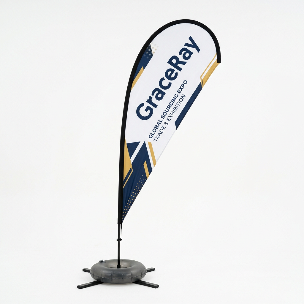 Custom teardrop flag banner with a printed graphic mounted on a pole and base at an outdoor event.
