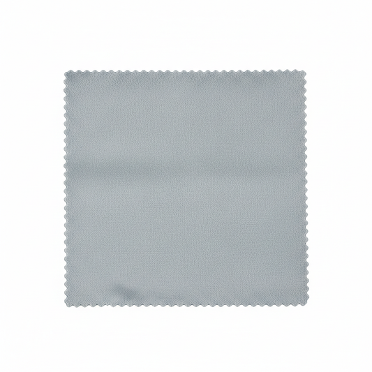 Premium microfiber lens cleaning cloth folded in slate grey with laser cut edge on white background