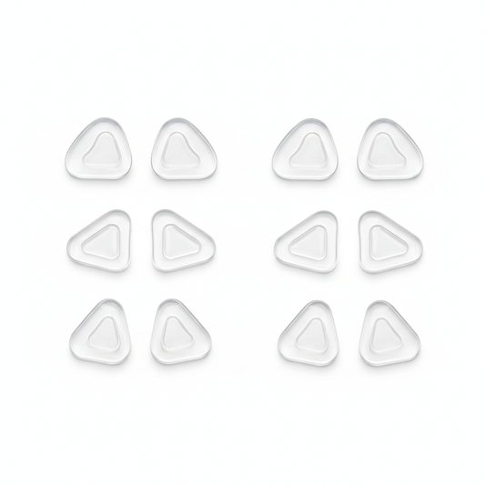 Silicone anti-slip eyeglass nose pads in multiple shapes arranged on white background