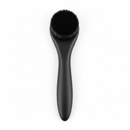 Eyeglass cleaning brush with soft bristles and matte black handle on white background