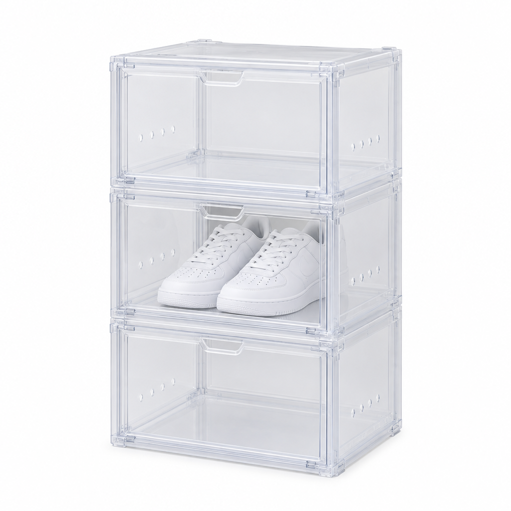 Stackable shoe box, three clear drop-front plastic shoe boxes stacked with sneakers inside on white background
