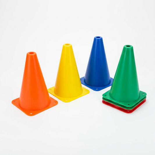 Colorful sports training cones arranged for outdoor agility drills and sports practice.