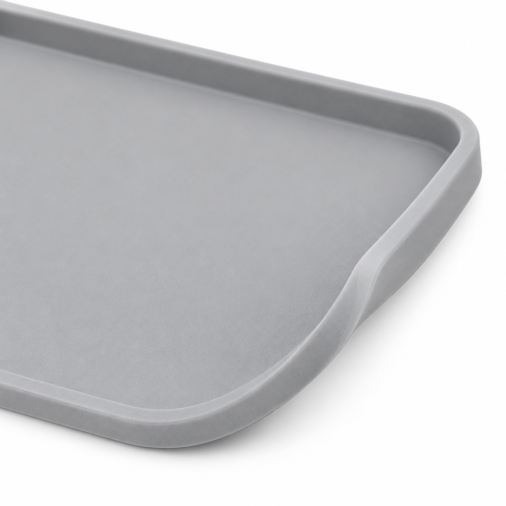 Close-up detail of silicone pet feeding mat showing raised containment edge and flexible food-grade texture