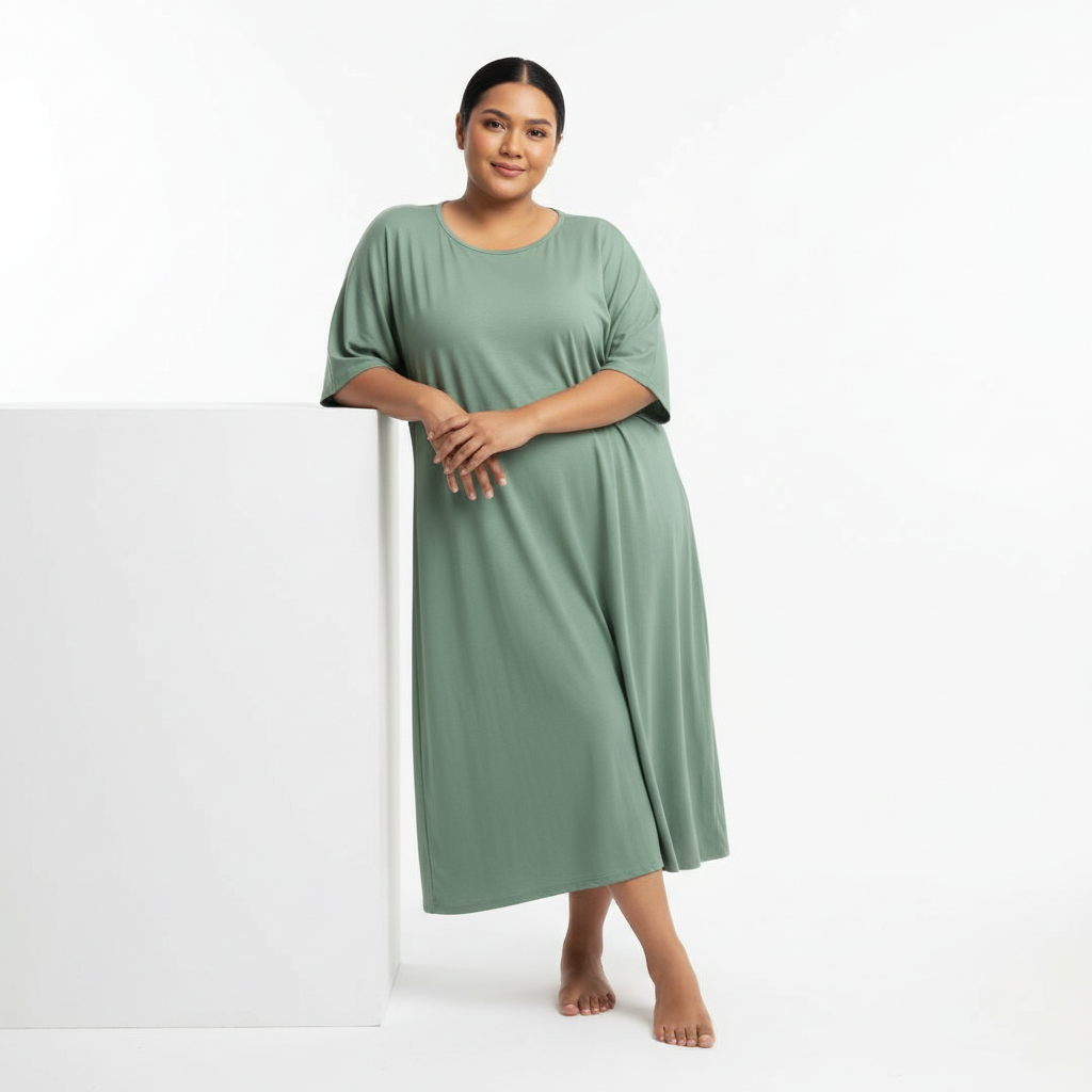 Malaysian woman sage green loose fit dress vacation pose