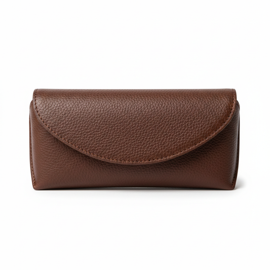 Magnetic closure eyeglass case in cognac brown leather closed position on white background