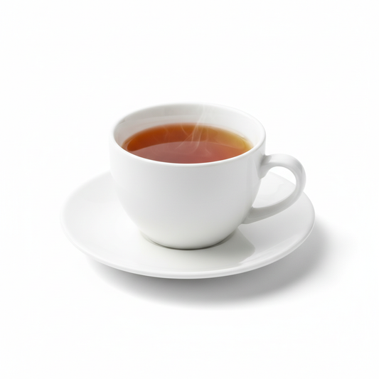 Classic white ceramic tea cup with amber tea on matching saucer on pure white background
