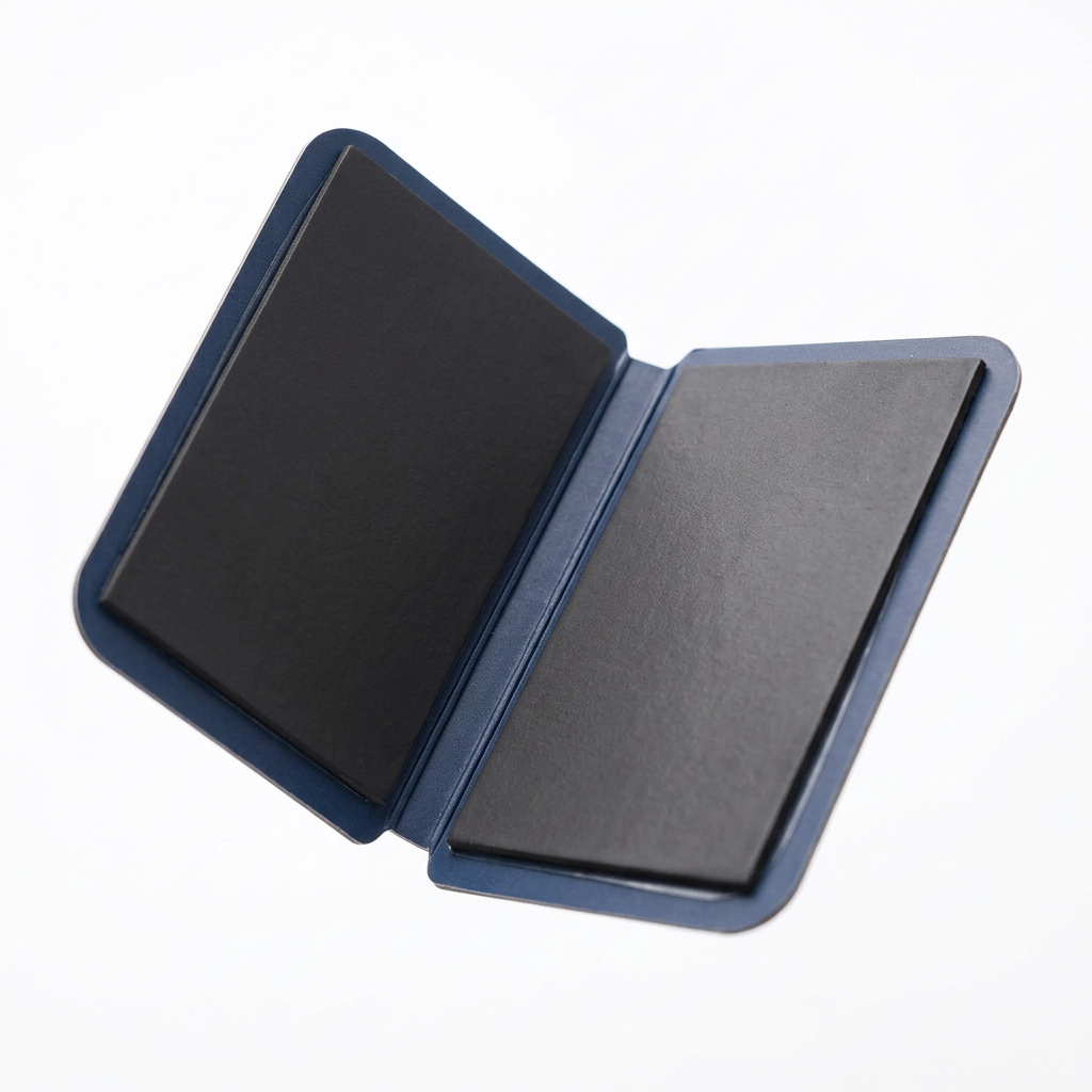 Detail close-up of magnetic bookmark showing internal rubber magnetic pads, score crease, and rounded corners on white background