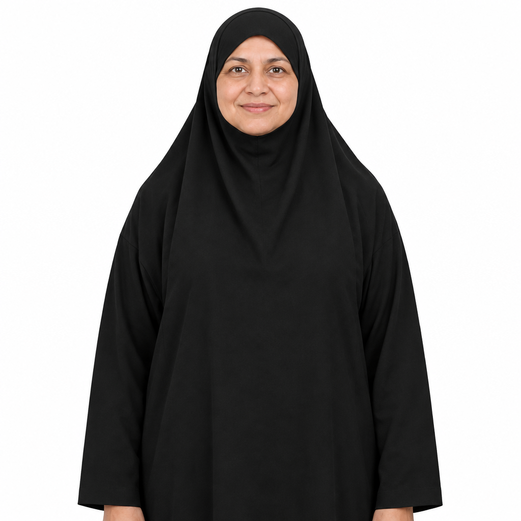 Close view of the attached head covering, face opening and shoulder drape of a black one-piece jilbab dress