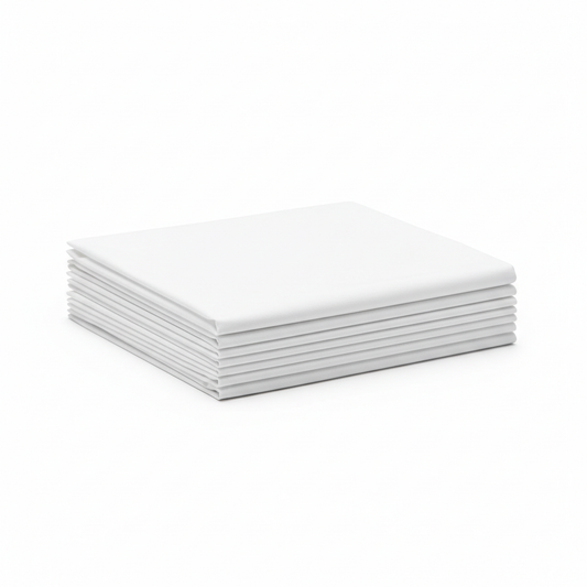 Crisp white hotel flat bed sheet neatly folded into precise rectangular stack showing smooth percale cotton weave texture on white background, commercial hospitality linen