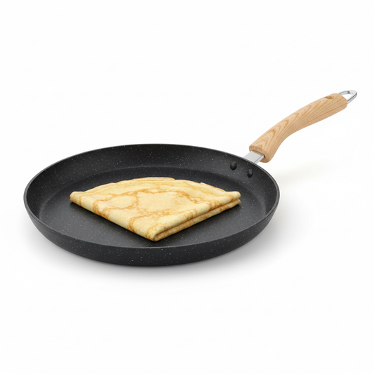 Round non-stick pancake and crepe pan with cooked golden crepe on pure white background