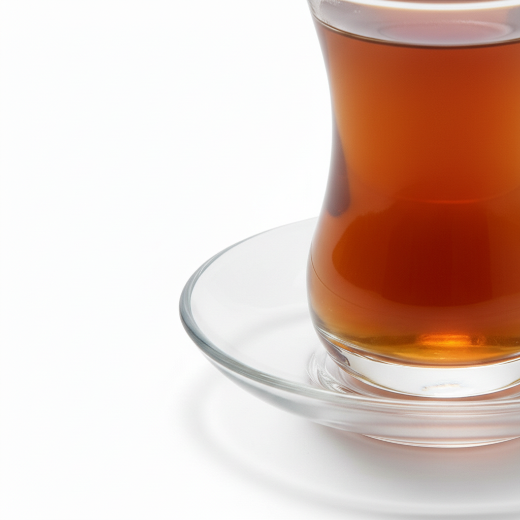 Close-up of curved waist and thick base on clear Arabic tea glass