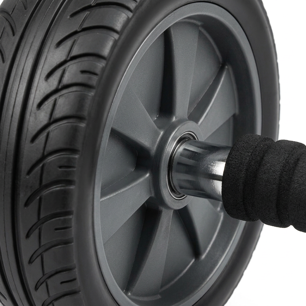 Detail close-up of abdominal exercise wheel rubber tire tread, ABS hub, and steel axle on white background