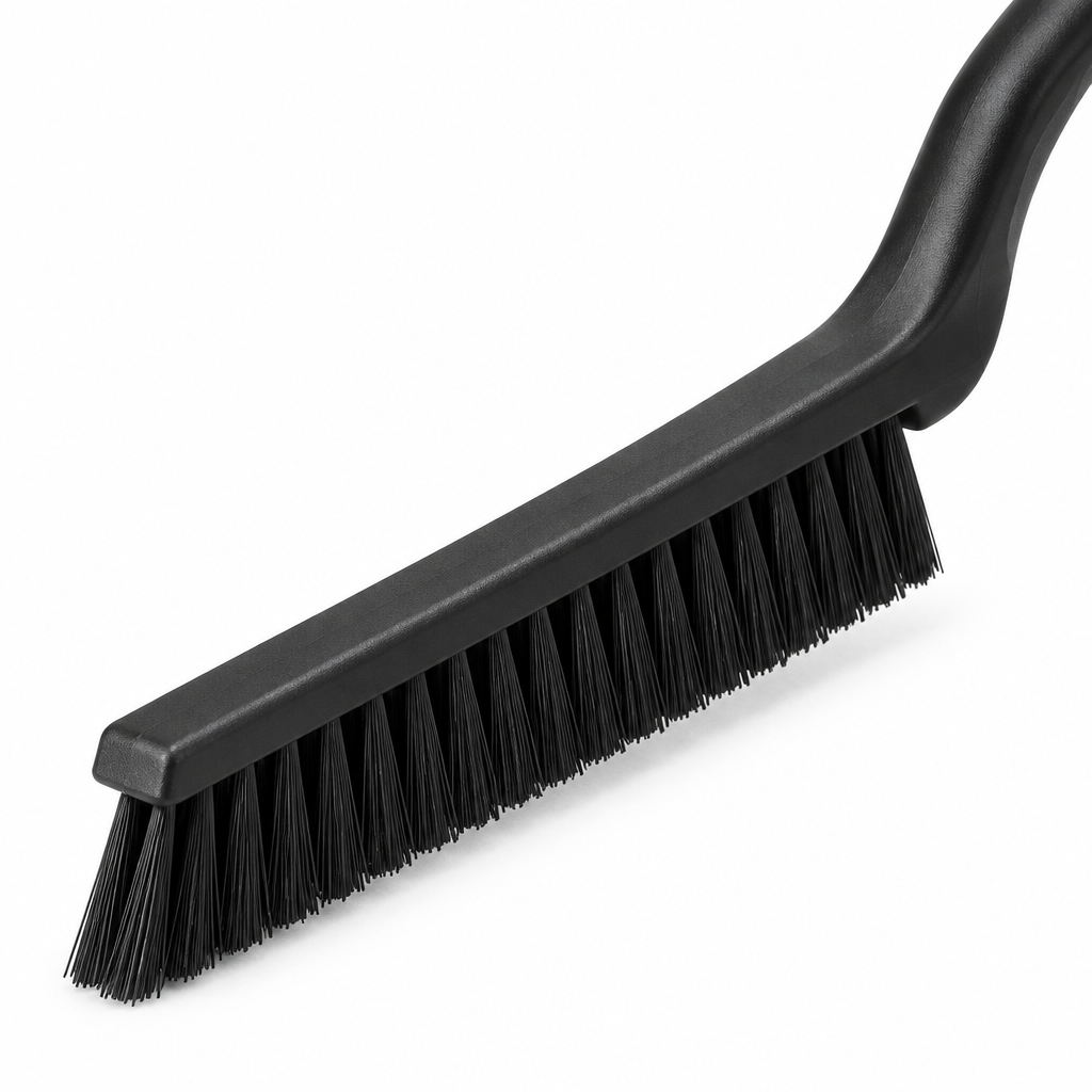 Close-up of the corner cleaning brush ultra-stiff bristles and angled narrow head
