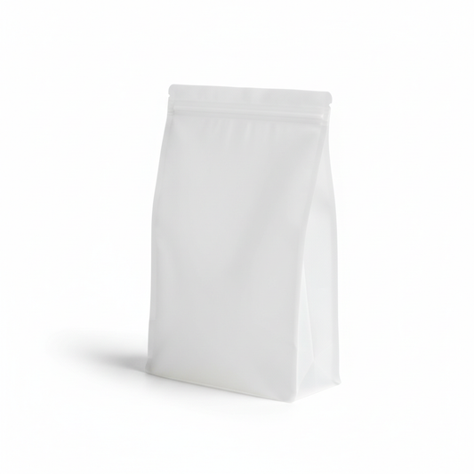 Translucent stand-up silicone food storage bag standing upright on pure white background