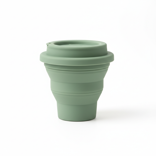 Collapsible silicone travel cup fully expanded on pure white background