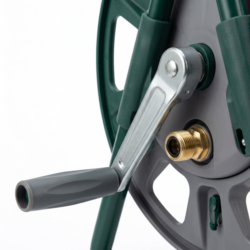 Macro close-up detail of garden hose reel folding metal crank arm, rotating grip handle, and brass water inlet fitting