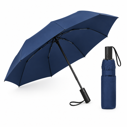 Navy blue three-fold automatic portable umbrella shown open beside a neatly folded unit with sleeve on white background