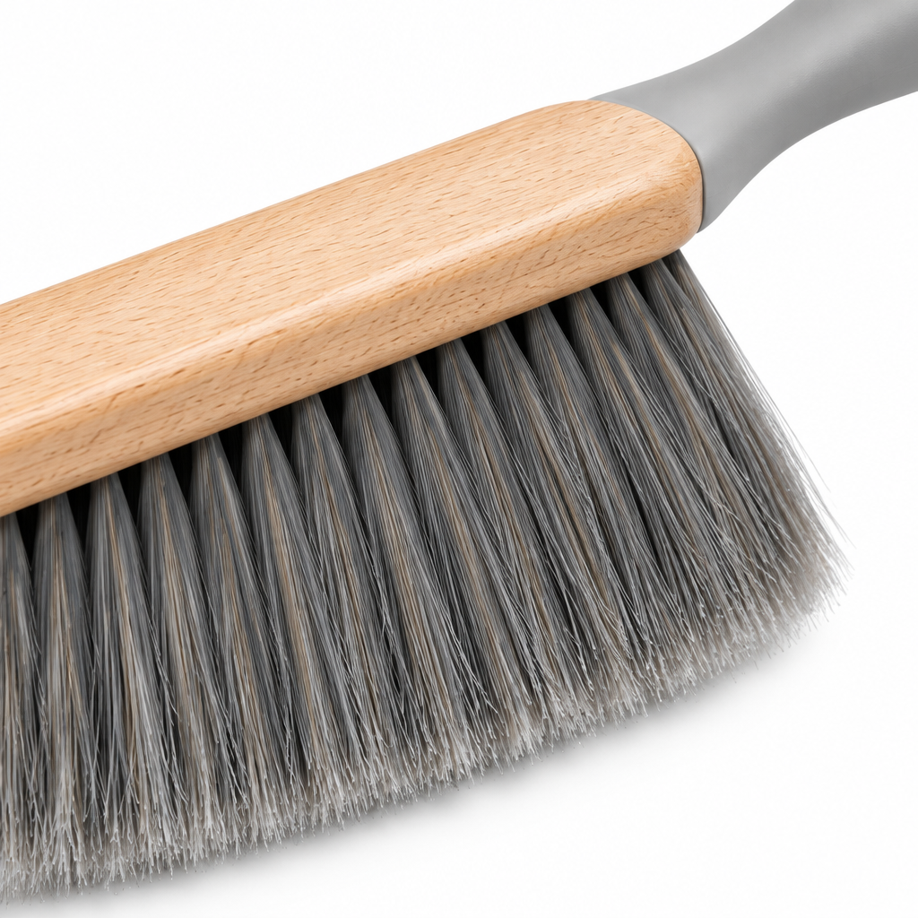 Close-up of the dusting brush dense soft split bristles, beechwood block, and gray handle
