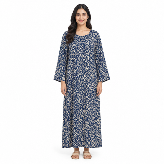Model wearing a full-length navy printed long-sleeve kaftan dress, front view on a white background