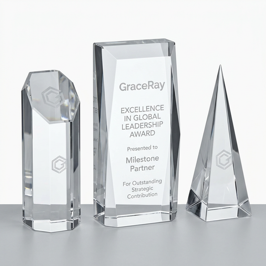 Custom engraved crystal awards with personalized text and logos for corporate recognition.