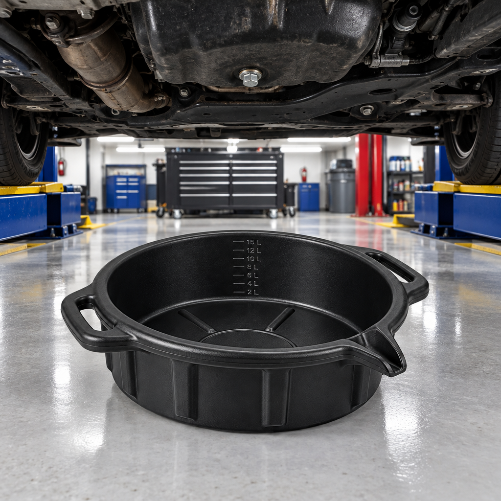 Automotive oil drain pan positioned beneath vehicle oil pan during oil change scene