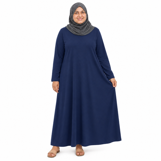 Model in a grey hijab wearing a dark navy loose-fit long-sleeve modest maxi dress on a white background